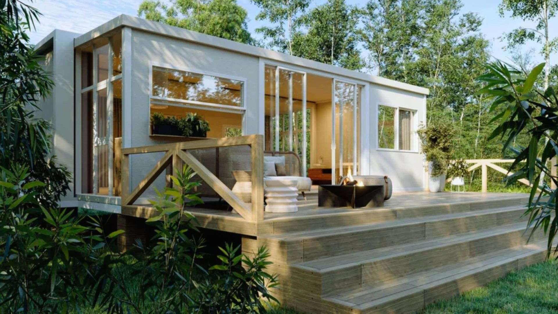 Luxury tiny home with high-end finishes - modern shed house exterior with glass walls, wood deck and fire pit