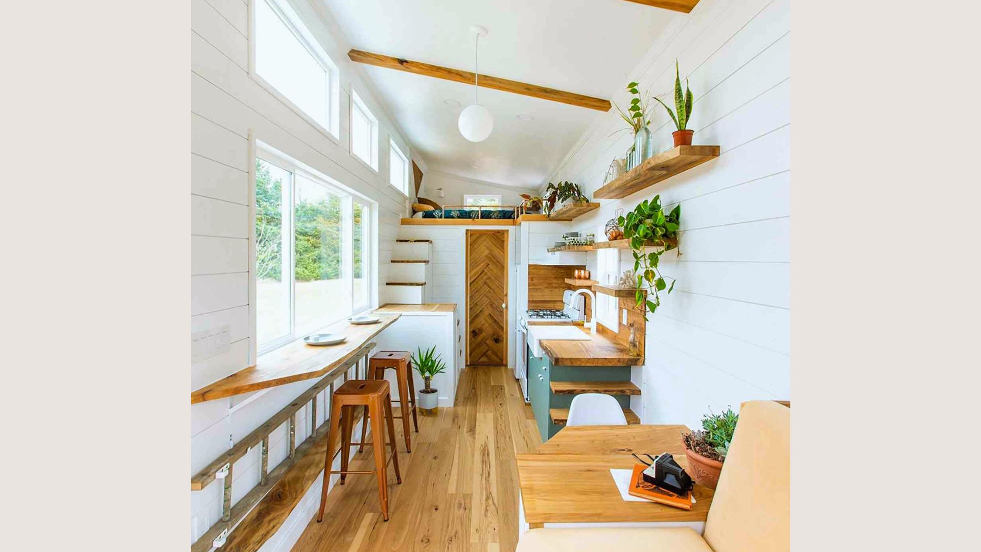 Choosing the right color palette for shed tiny house - white shiplap walls, warm wood tones and sage green cabinets