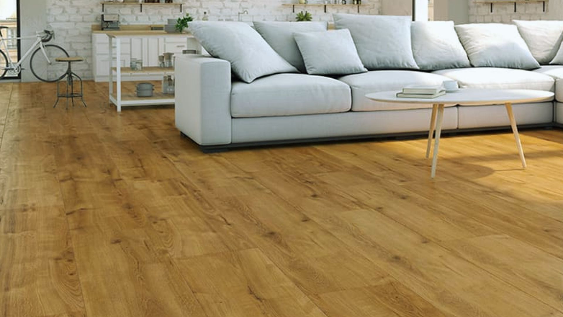 Flooring options for durability and style - wide plank natural wood hardwood floor in bright living room with sofa