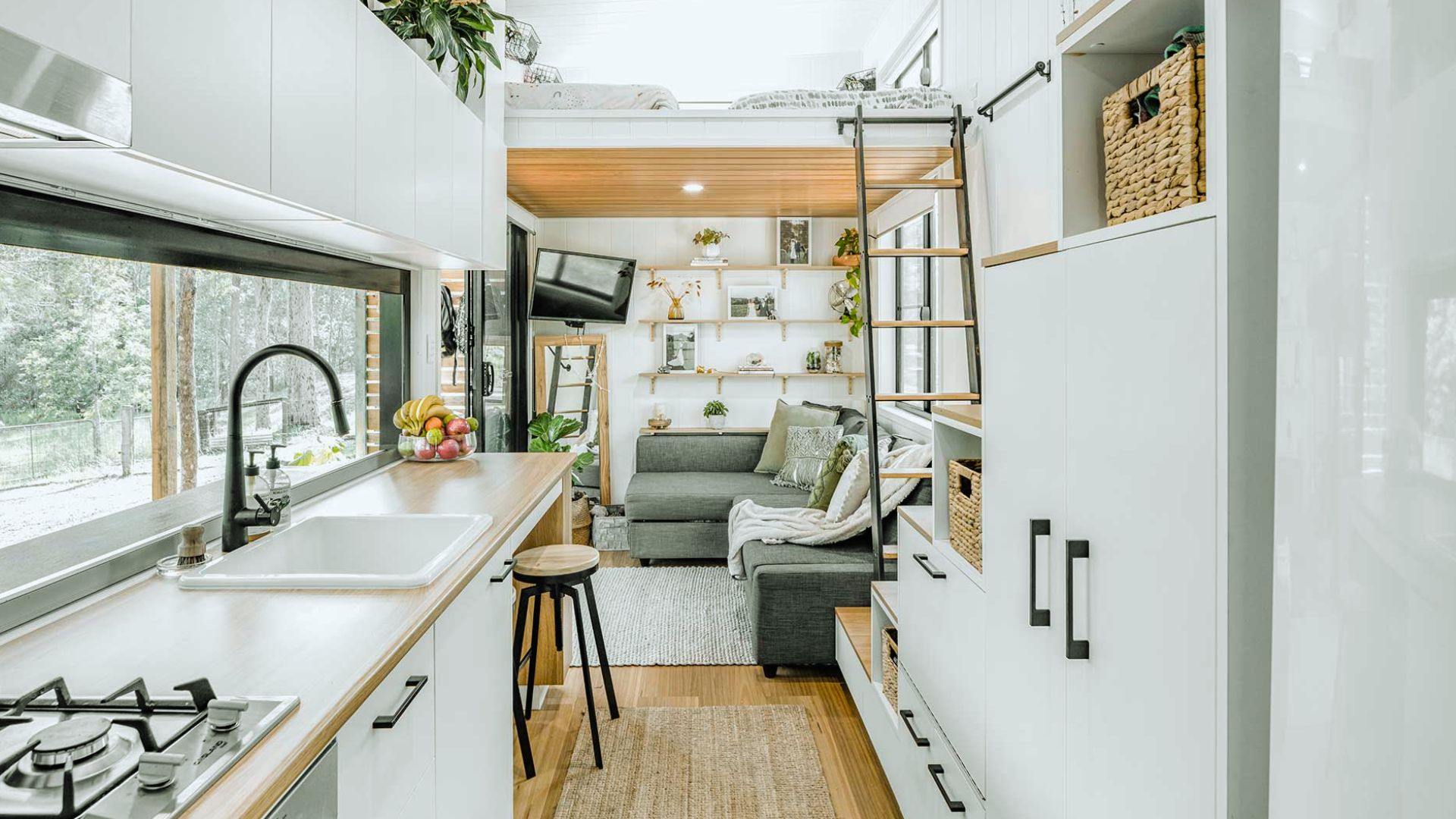 Lighting ideas to make small shed feel bigger - long kitchen window, glass doors and recessed light under loft