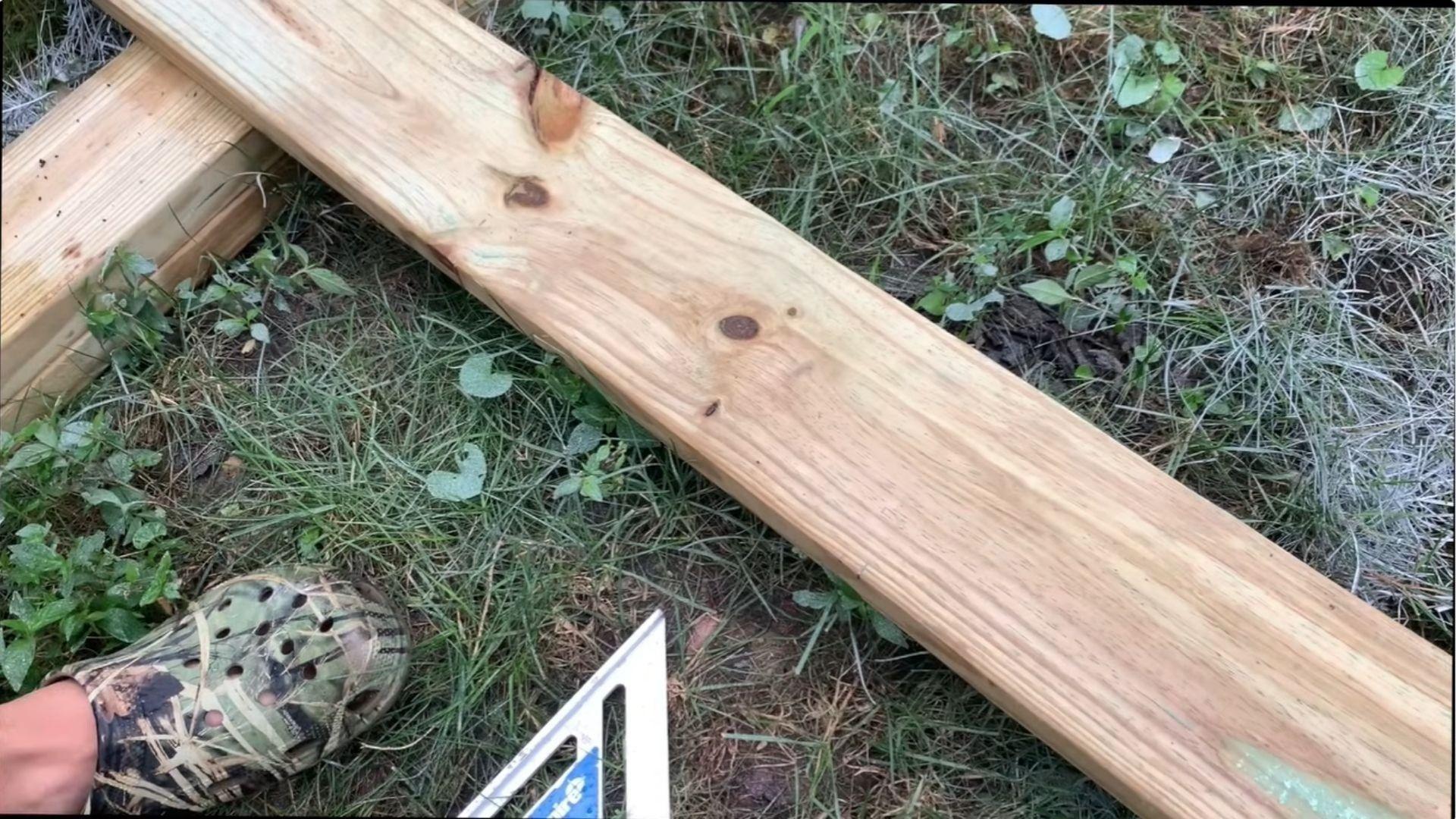 Shed roof rafter with birdsmouth heel and seat cuts marked for a 2/12 pitch