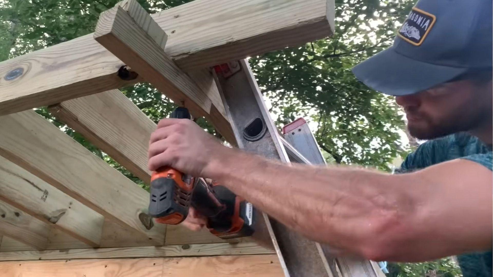 Shed roof fascia boards attached to side overhang rafters with blocking between rafters