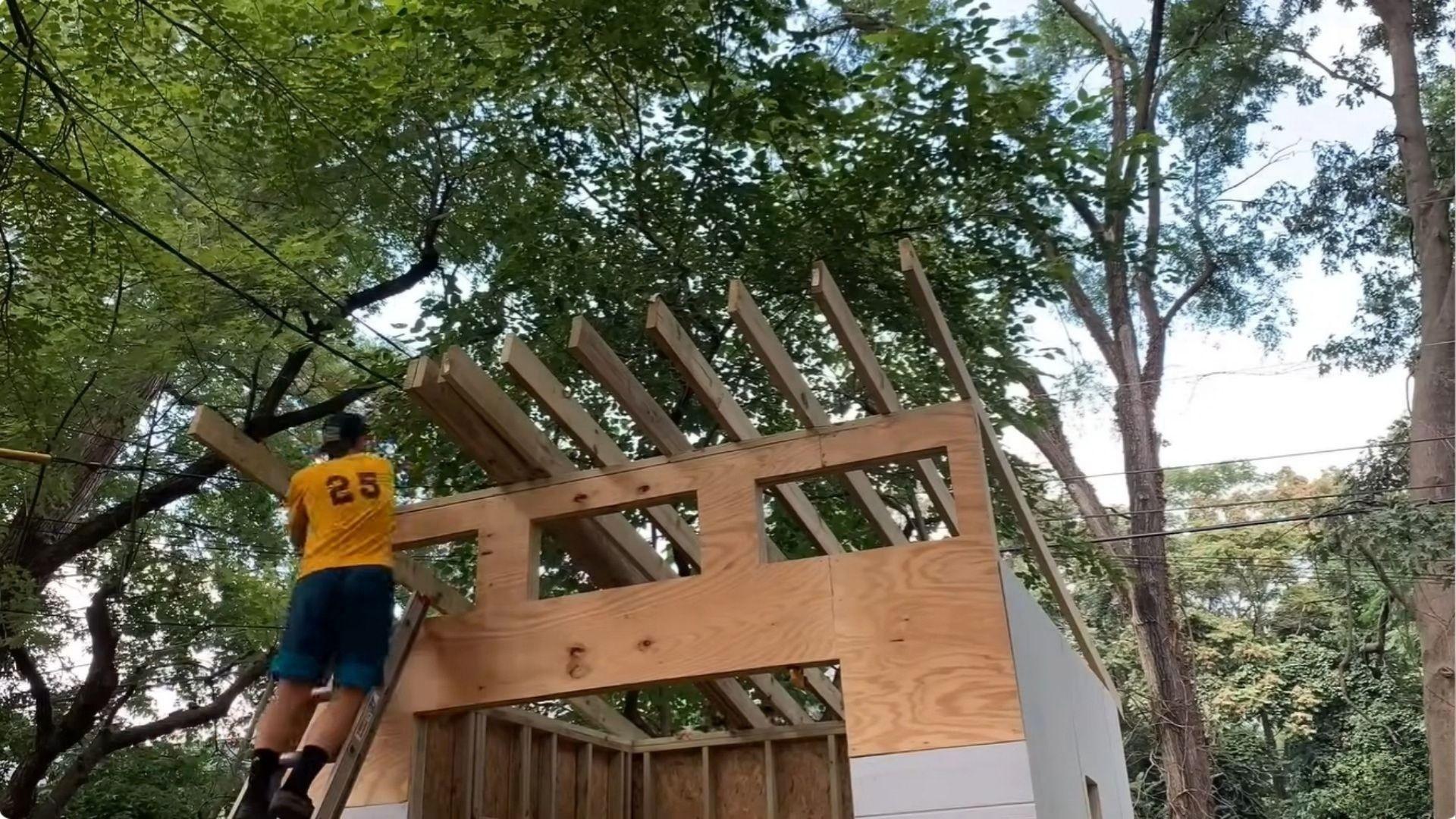 Shed roof rafters set on top plates with hurricane ties and rafter ties attached