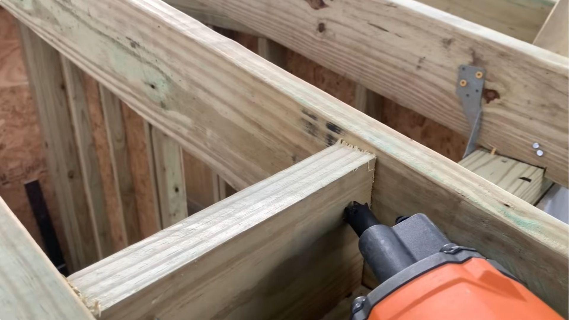 Shed roof blocking pieces fitted between rafters above the wall plates