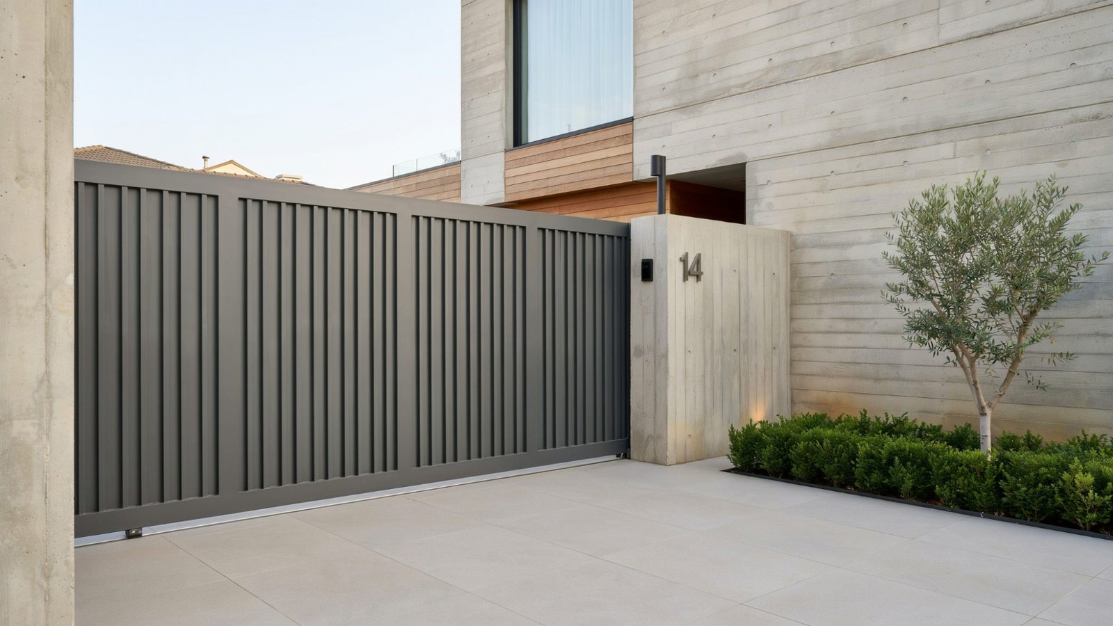 Modern sliding courtyard gate designed for compact outdoor spaces.