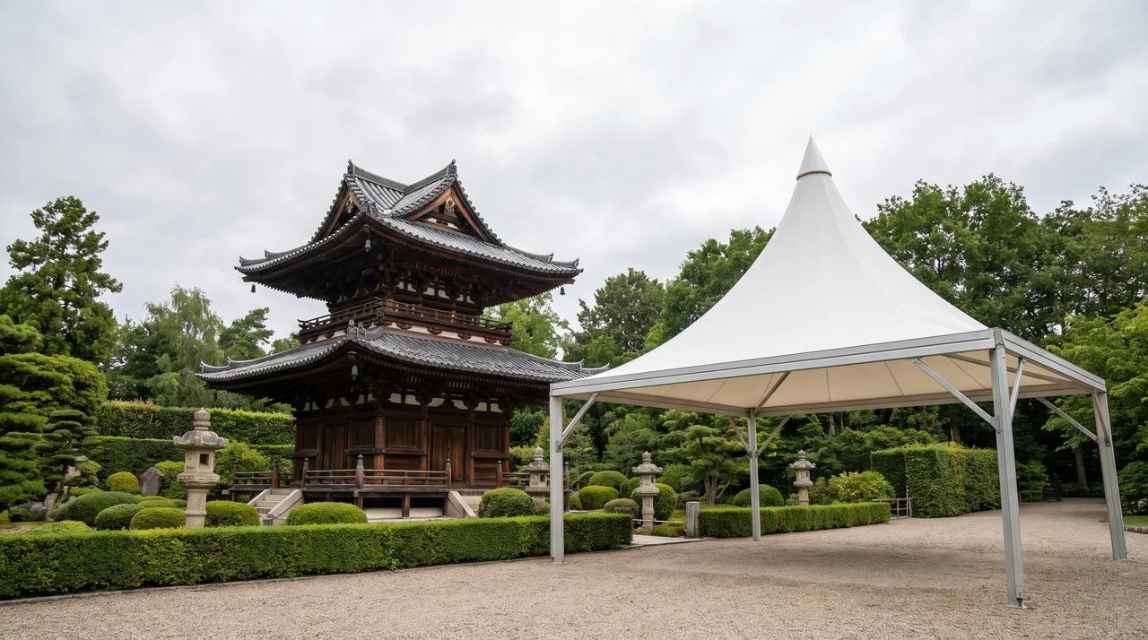 Asian pagoda with tiered roofs and a modern pagoda tent in a landscaped setting