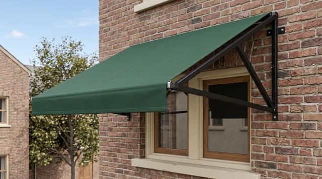 Fixed awning with fabric cover stretched over a set frame on a building's exterior wallFile name-fixed-awning-stretched-over-frame